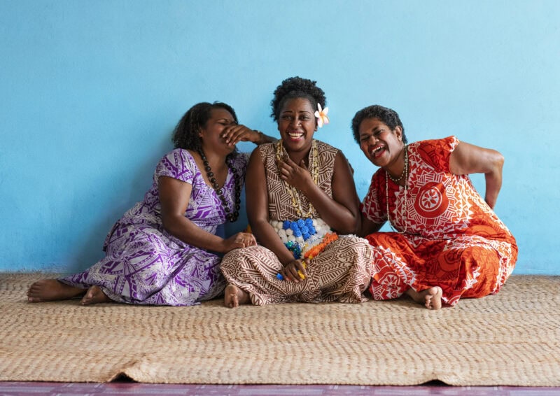 Fijian women laughing together.